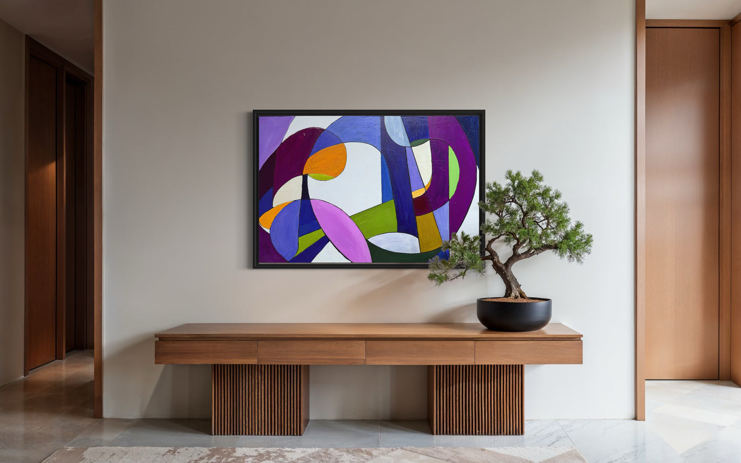 Modern interior with a colorful abstract painting on the wall above a wooden console table.