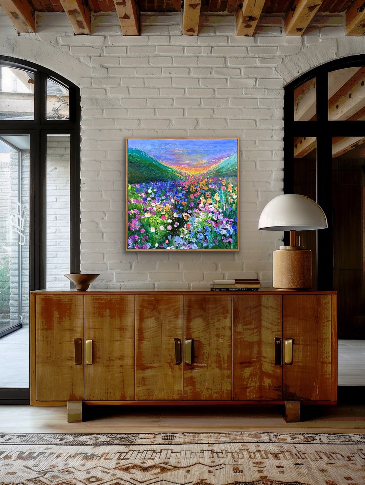 Framed impressionist landscape painting by Maria-Victoria Checa shown in a room.