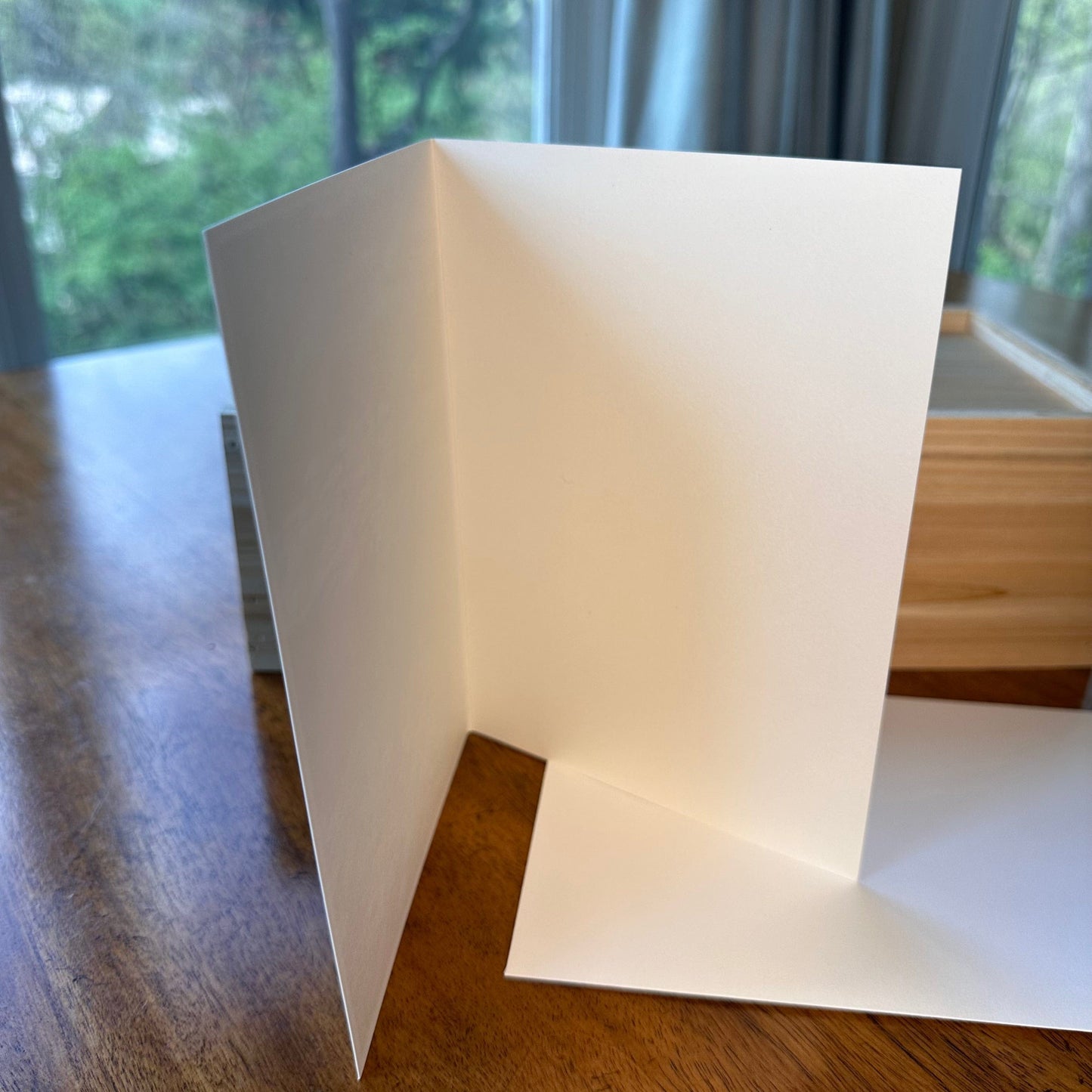 Blank white interior of folded art greeting card showing premium matte paper quality — Checa Art stationery
