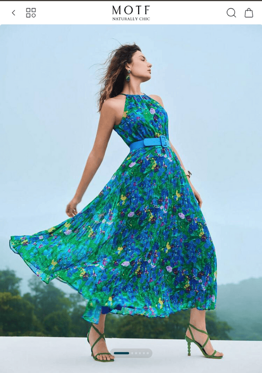 Orange Iris painting by Maria-Victoria Checa featured in MOTF Checa Art Collection Spring 2024 fashion campaign, blue and green floral dress