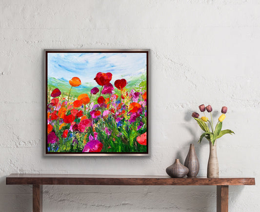 abstract impressionist oil painting of a field of flowers in tones of  of oranges and purples  hanging in room next to tulips