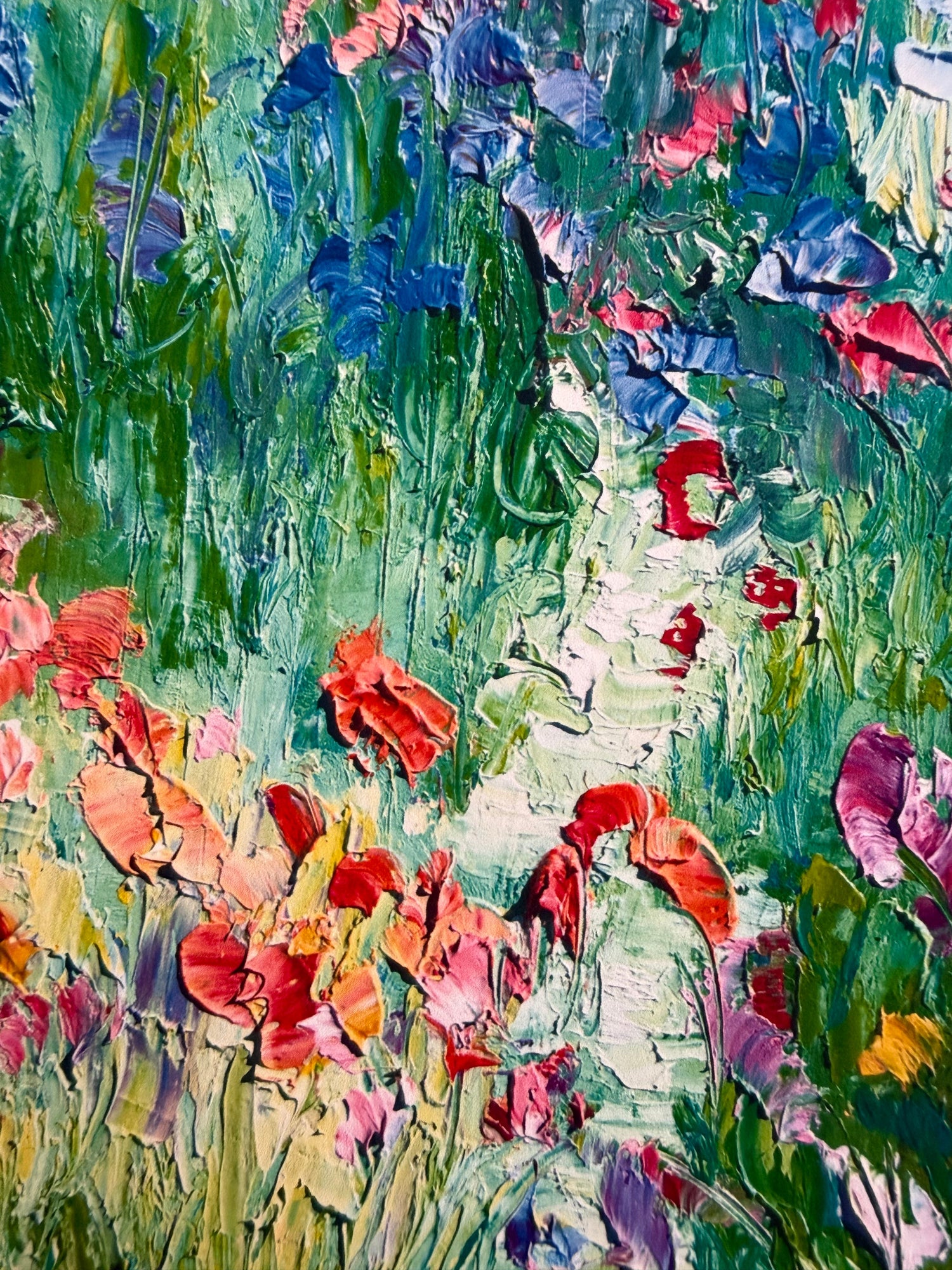 Close-up detail showing texture of a fine art print of the painting A Stroll in a Flower Field by Washington, DC based artist Maria-Victoria Checa. 