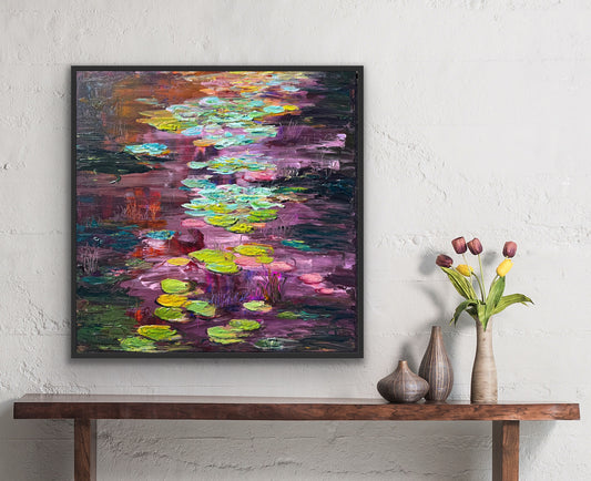 Impressionist landscape painting by Maria-Victoria Checa displayed over a side table with tulips.