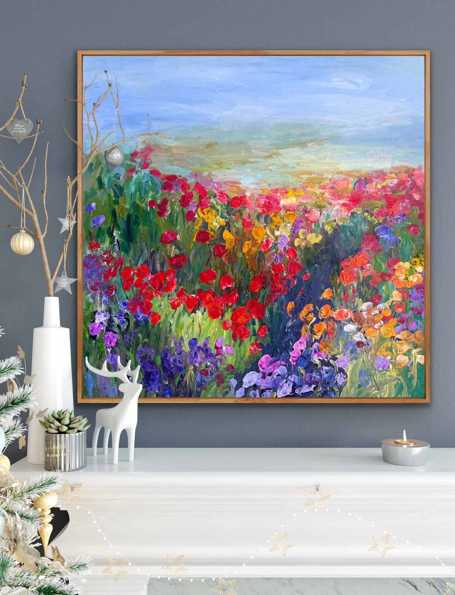 Framed impressionist landscape painting by Maria-Victoria Checa displayed on top of a mantle.
