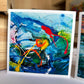 Blue Abstract Greeting Card — 5×5 abstract painting in luminous cobalt blue with bold red drips and orange swirl accents, by Washington DC artist Maria-Victoria Checa