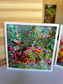 Lush Garden in Bloom Greeting Card — 5×5 impressionist painting of deep red, pink and purple flowers in a rich green garden, by Washington DC artist Maria-Victoria Checa
