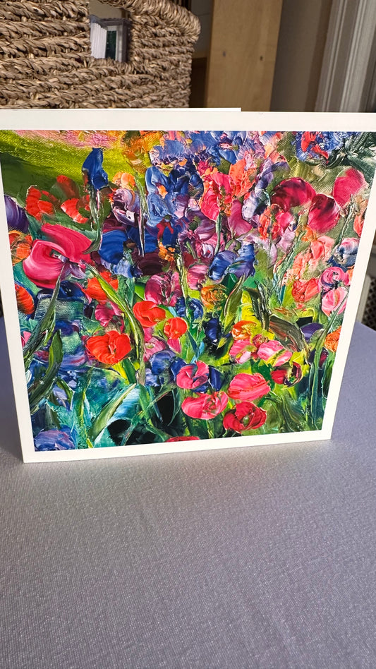 red, pink, orange blooms with blue irises):
Flower Field Greeting Card — 5×5 impressionist painting of red tulips, pink blooms and blue irises in a vibrant garden, by Washington DC artist Maria-Victoria Checa