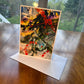 Dark abstract painting greeting card with red, yellow and green accents and expressive splatter marks — art card by Maria-Victoria Checa