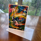 Colorful abstract painting greeting card with bold red line and swirling blue, green and yellow brushstrokes — art card by Maria-Victoria Checa