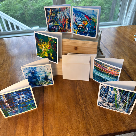 Greeting Card Set Box 6 Deep Blue — seven bold abstract art greeting cards displayed around a wood box, by Washington DC artist Maria-Victoria Checa