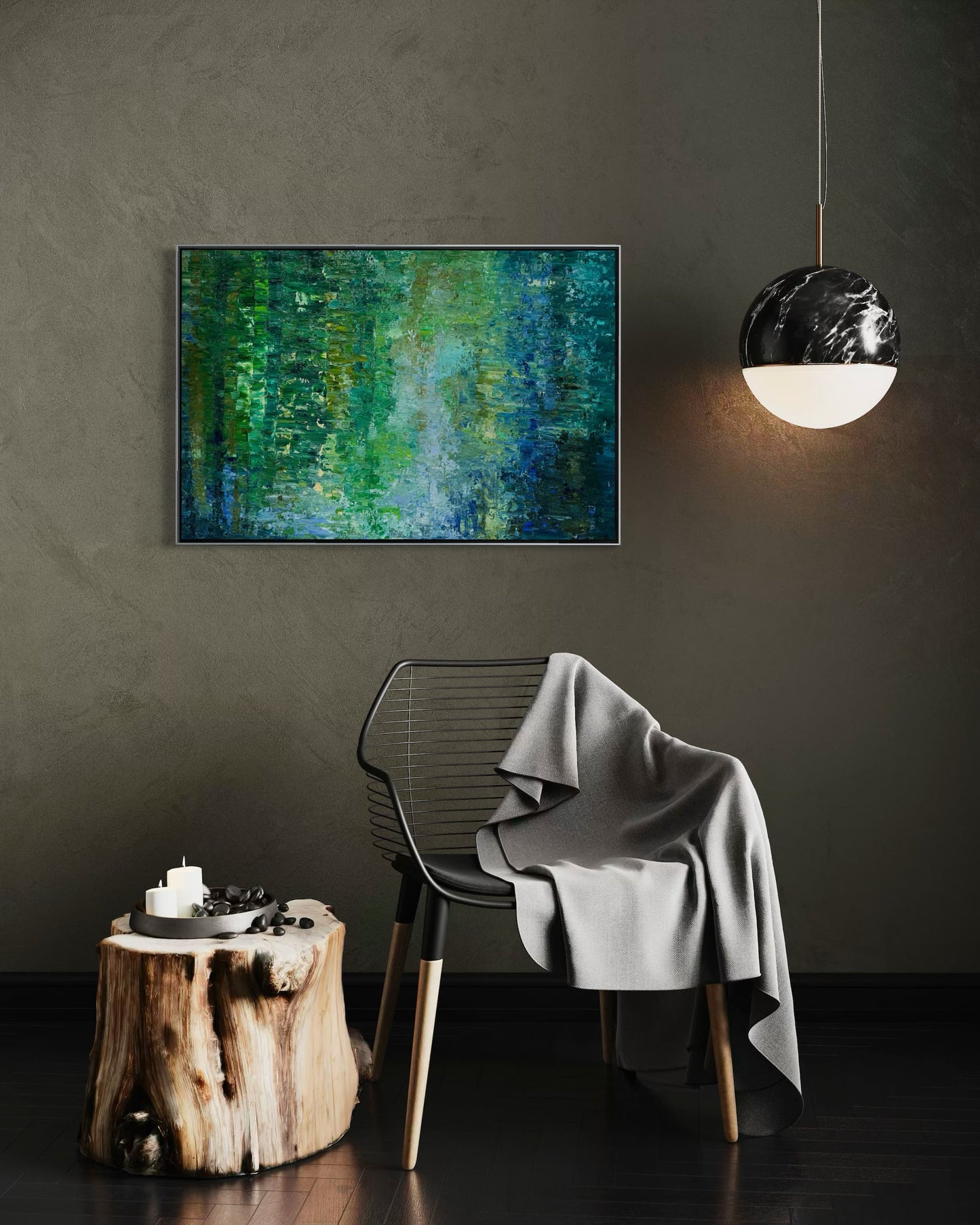 Water Reflection abstract oil painting by Maria-Victoria Checa in a silver float frame displayed on a dark olive wall beside a marble pendant light in a moody contemporary interior