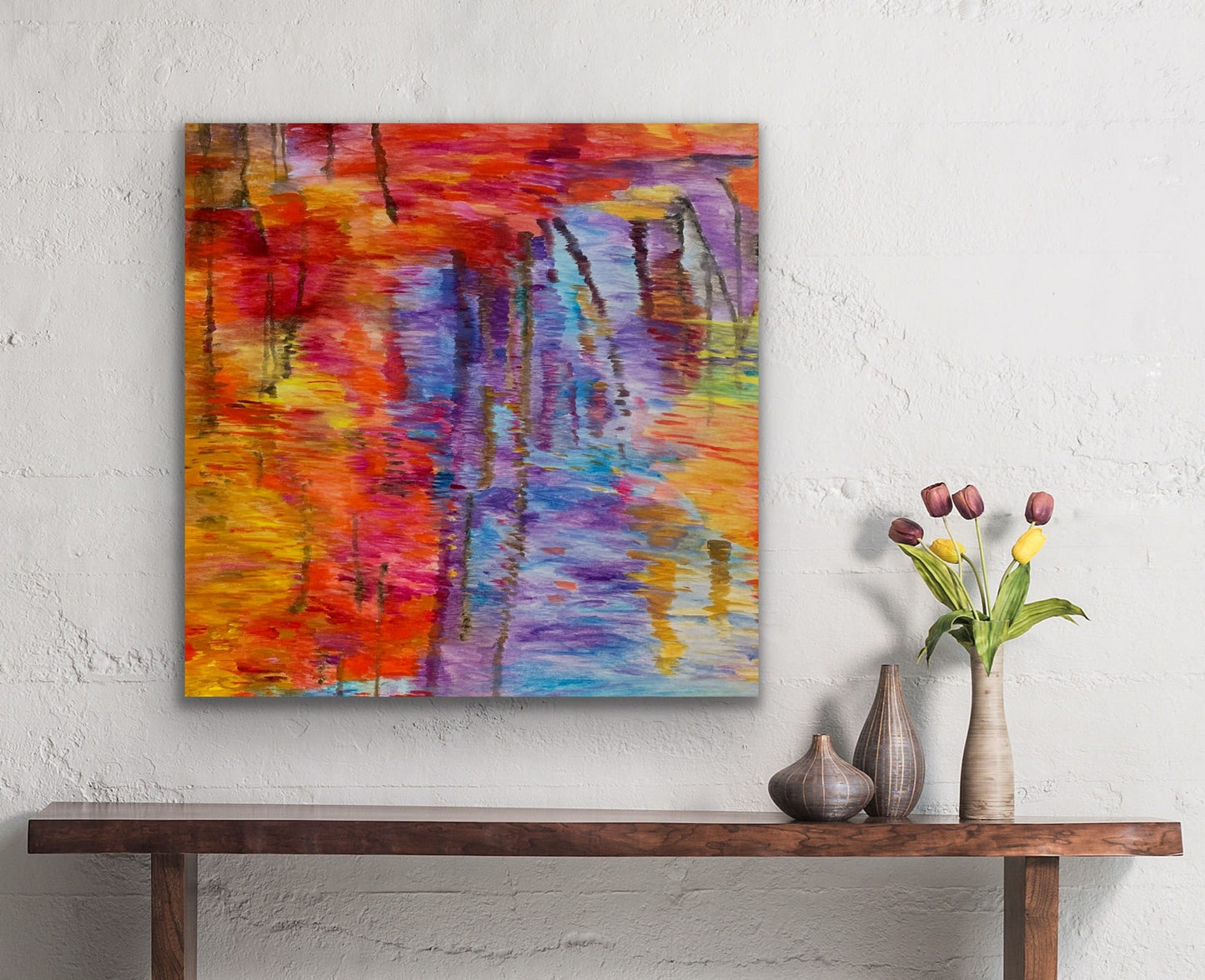 Abstracted Water Reflection painting displayed on white wall above wood console