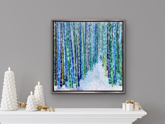 Impressionist landscape painting by Maria-Victoria Checa styled in a frame above a ledger in a modern living space.