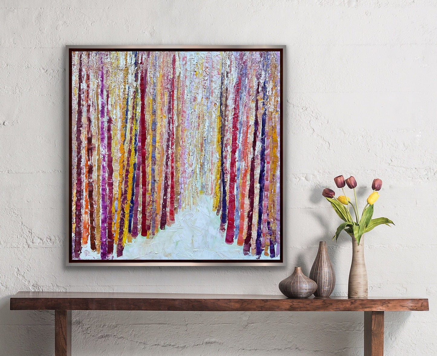 Bamboo Path abstract textured painting hanging above a wooden console with tulips and ceramic vases, by artist Maria-Victoria Checa.