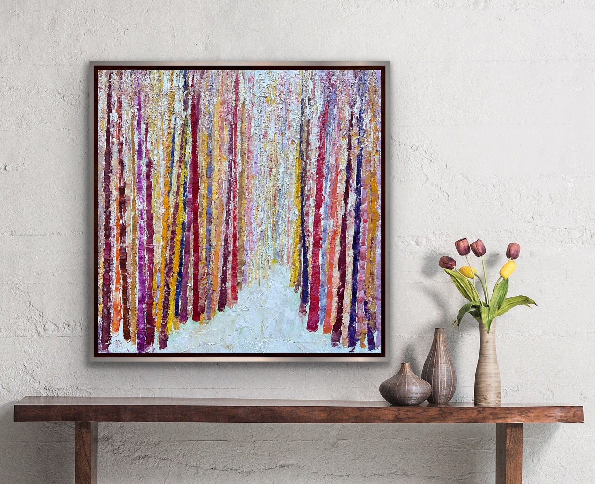 Bamboo Path abstract textured painting hanging above a wooden console with tulips and ceramic vases, by artist Maria-Victoria Checa.