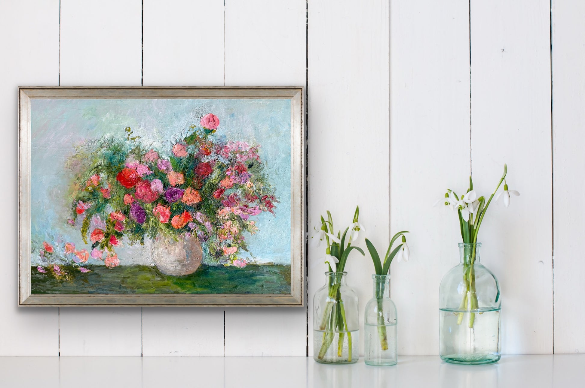Bouquet of Roses impressionist floral painting by Maria-Victoria Checa shown framed above a console table.