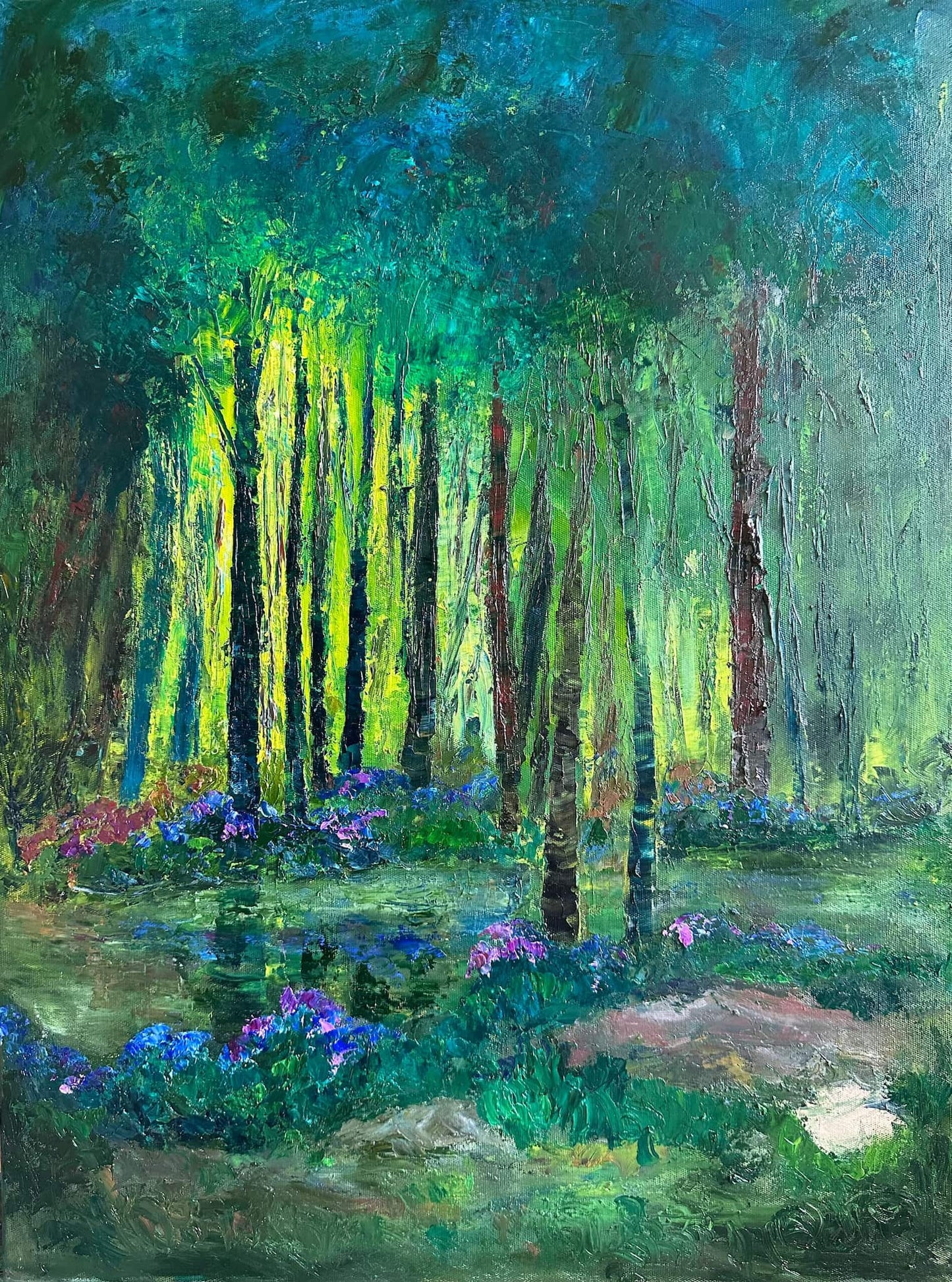 Original impressionist oil painting, 24×18 in. Luminous green forest with golden light, blue wildflowers and a quiet creek. Ships worldwide.