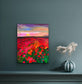 Fine art print of Coquelicots by Maria-Victoria Checa displayed on a teal wall with decorative vase
