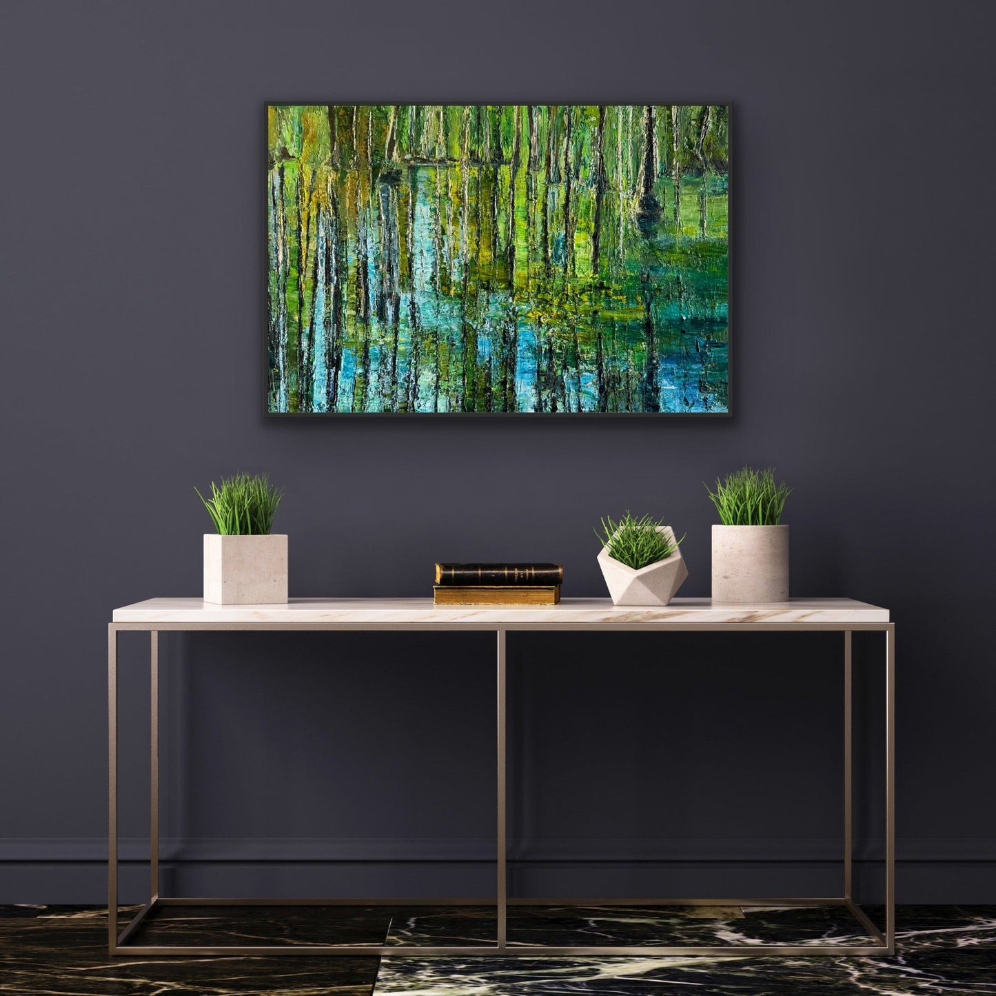Framed impressionist landscape painting by Maria-Victoria Checa shown over a side table.