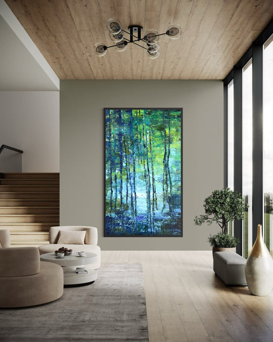 Cypress Gardens Reflection 3 by Maria-Victoria Checa displayed in a modern living room with neutral armchairs, wood accents, and soft natural light. Large blue-green abstract landscape painting inspired by water reflections.