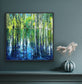 Cypress Gardens Reflection canvas print by Maria-Victoria Checa in a dark float frame displayed on a deep teal wall above a console table with a sculptural vase, showing scale in a moody modern interior