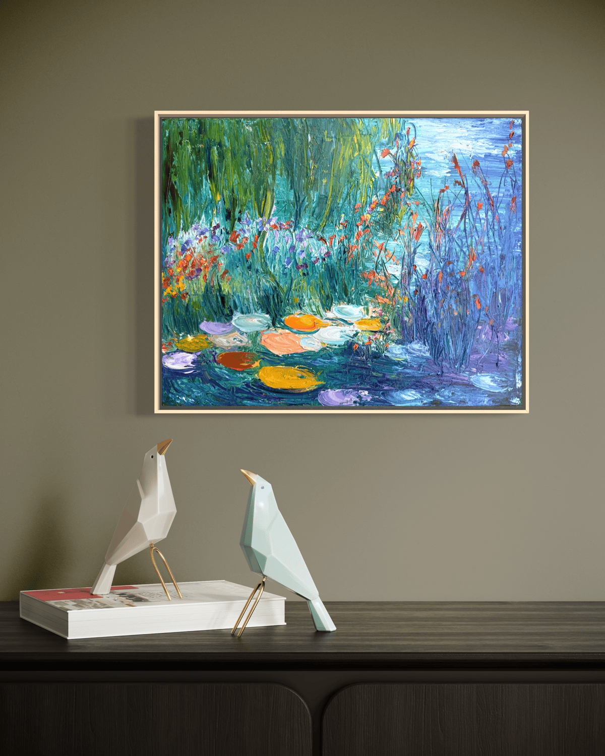“Daydream” framed impressionist painting by Maria-Victoria Checa displayed above a modern console with decorative objects.