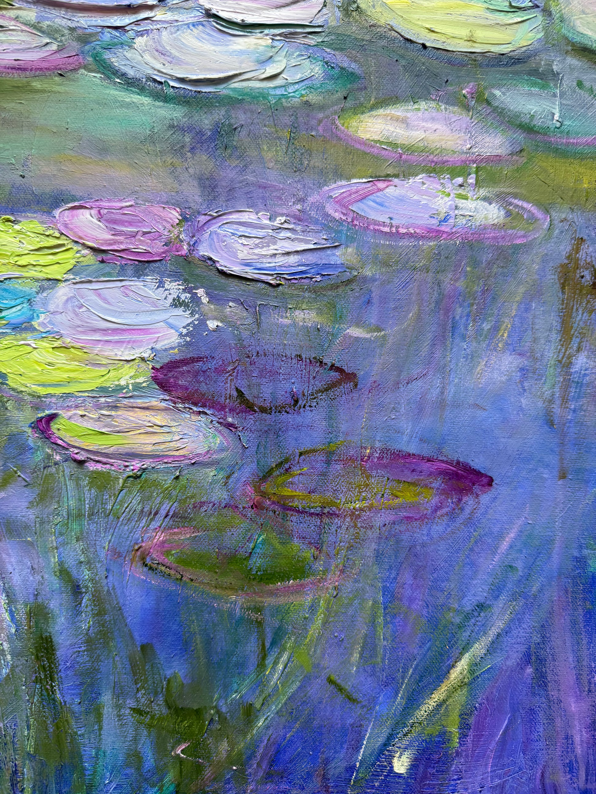 Colorful abstract painting of water lilies with a focus on purple and green hues.