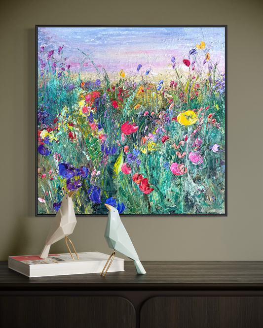Flower Field at Dusk painting by Maria-Victoria Checa shown in a modern interior on a dark wood console with decorative bird sculptures