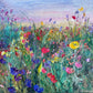 Flower Field at Dusk impressionist fine art print by Maria-Victoria Checa featuring a lush palette knife wildflower meadow in purple, red, pink, yellow, and blue blooms against a soft lavender and pink dusk sky