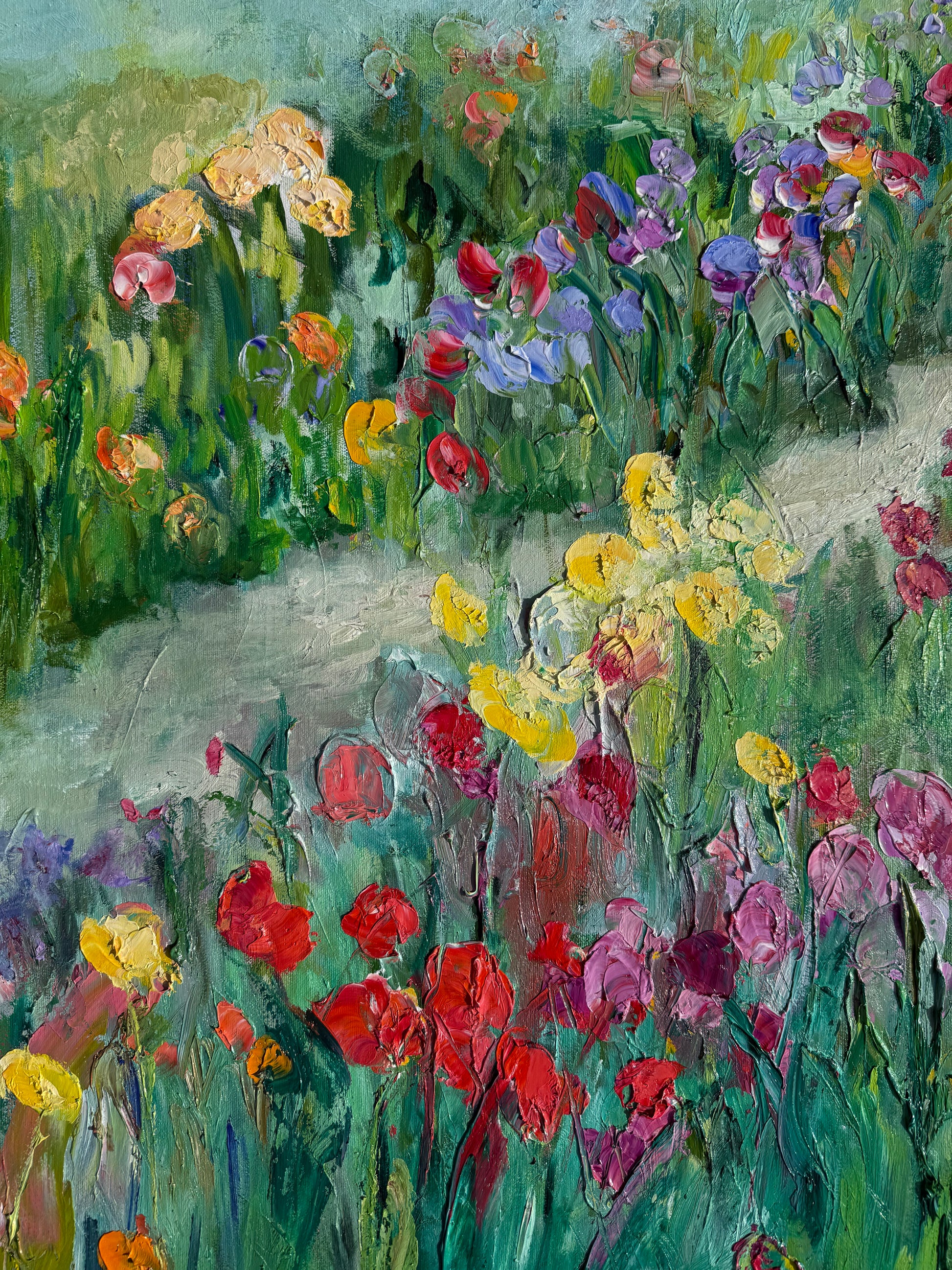Close-up detail of Happy Place painting showing textured brushstrokes and red, yellow, and lavender flowers.