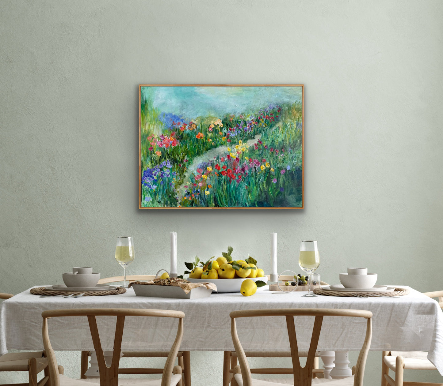 Happy Place painting hanging in a soft sage dining room with natural wood table setting.