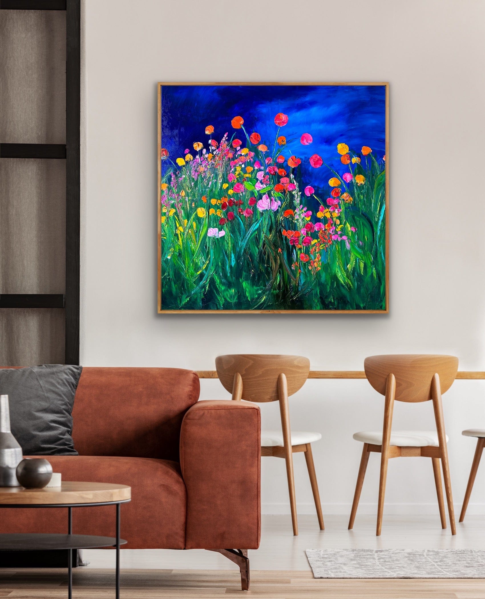 Framed impressionist landscape painting by Maria-Victoria Checa displayed in a modern living-room.