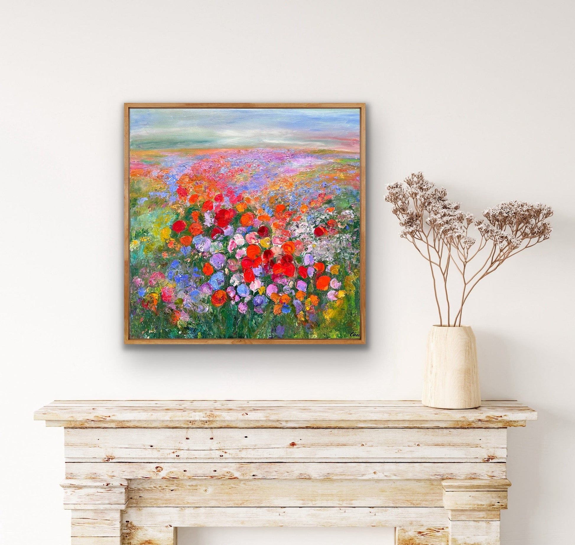 Prairie impressionist flower field painting displayed above mantle by Maria-Victoria Checa