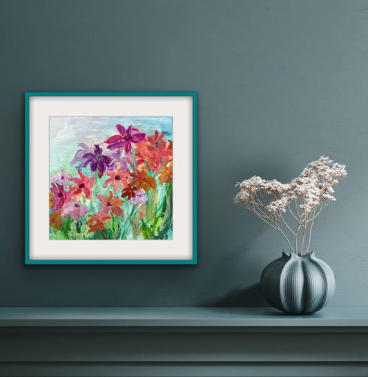 "Joie de Vivre impressionist floral watercolor by Maria-Victoria Checa of Checa Art framed in teal on a wall above a shelf with a decorative vase"