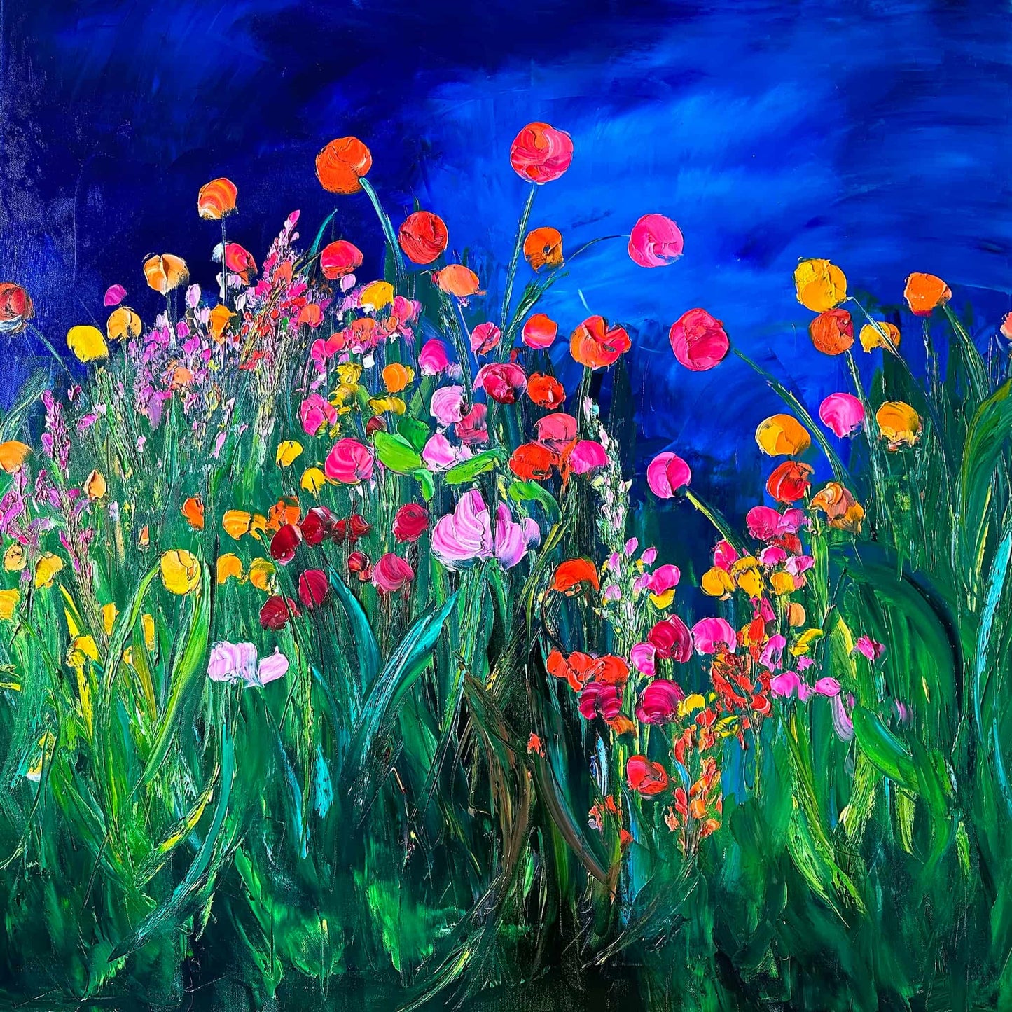 Midnight Dream impressionist painting by Maria-Victoria Checa featuring vibrant palette knife wildflowers in orange, red, pink, and yellow rising from deep green foliage against a dramatic cobalt blue night sky.