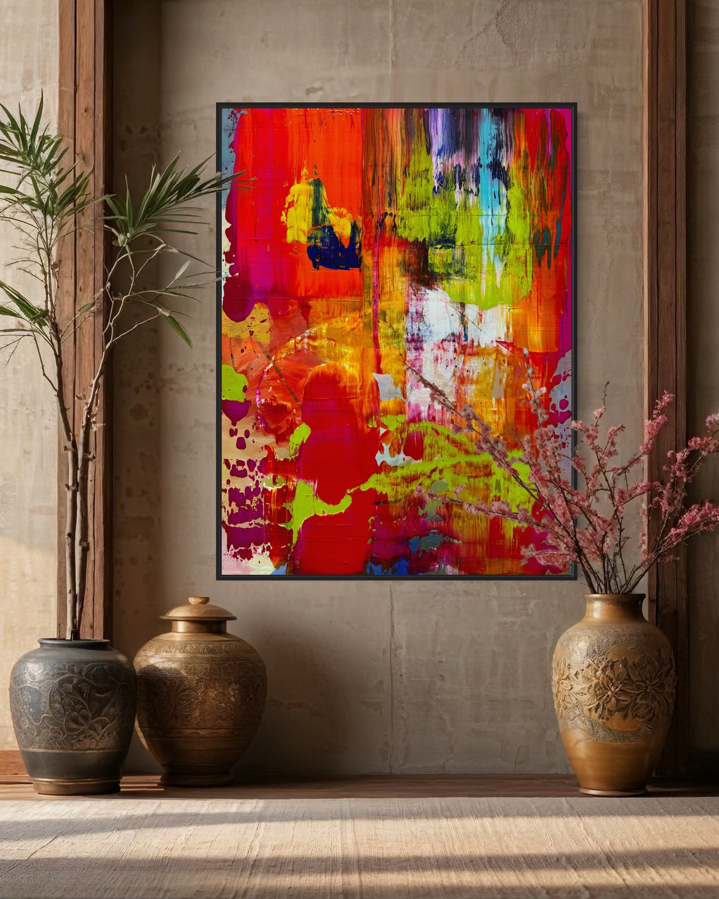 On Fire! abstract painting displayed in a warm neutral interior with earthen vases and natural light, showcasing its bold red, green, and blue palette.