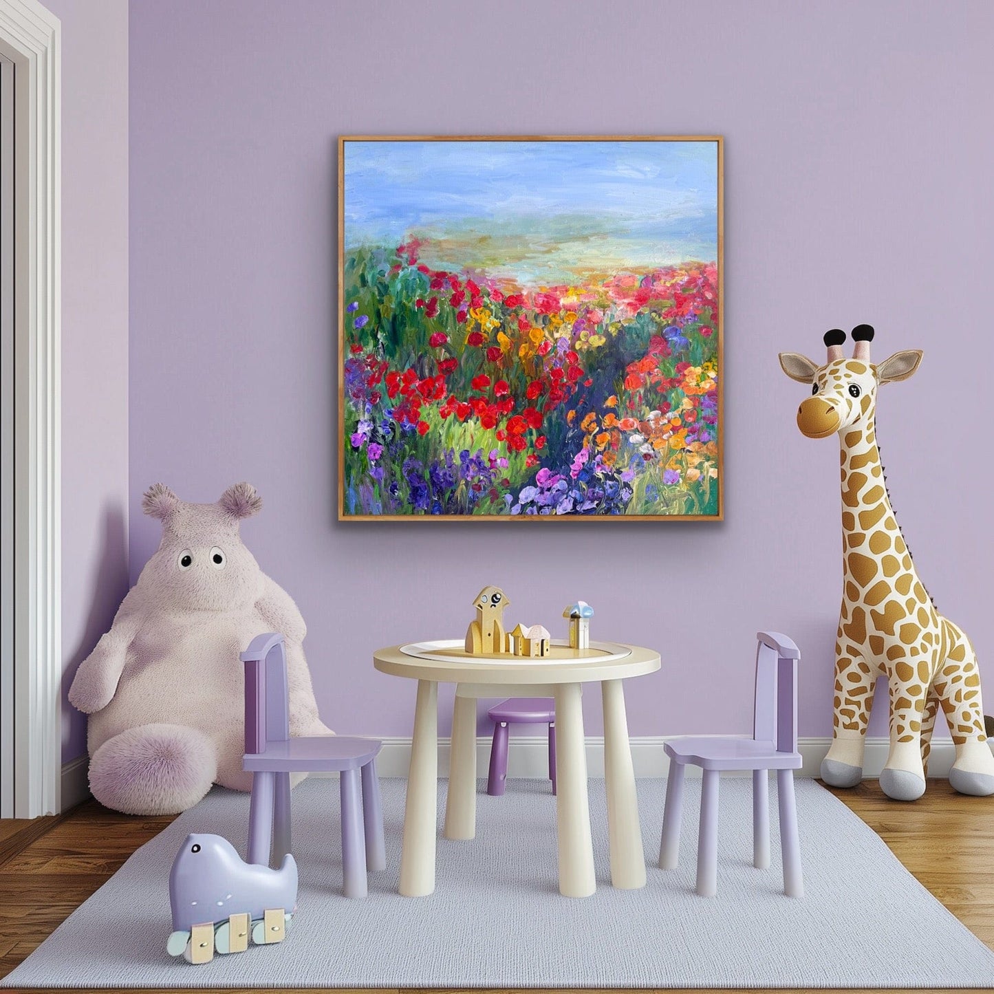 A colorful impressionist flower path painting titled Path in the Meadow by Maria-Victoria Checa hanging in a lavender children’s room above a small play table with toys, a plush animal, and a giraffe figure.