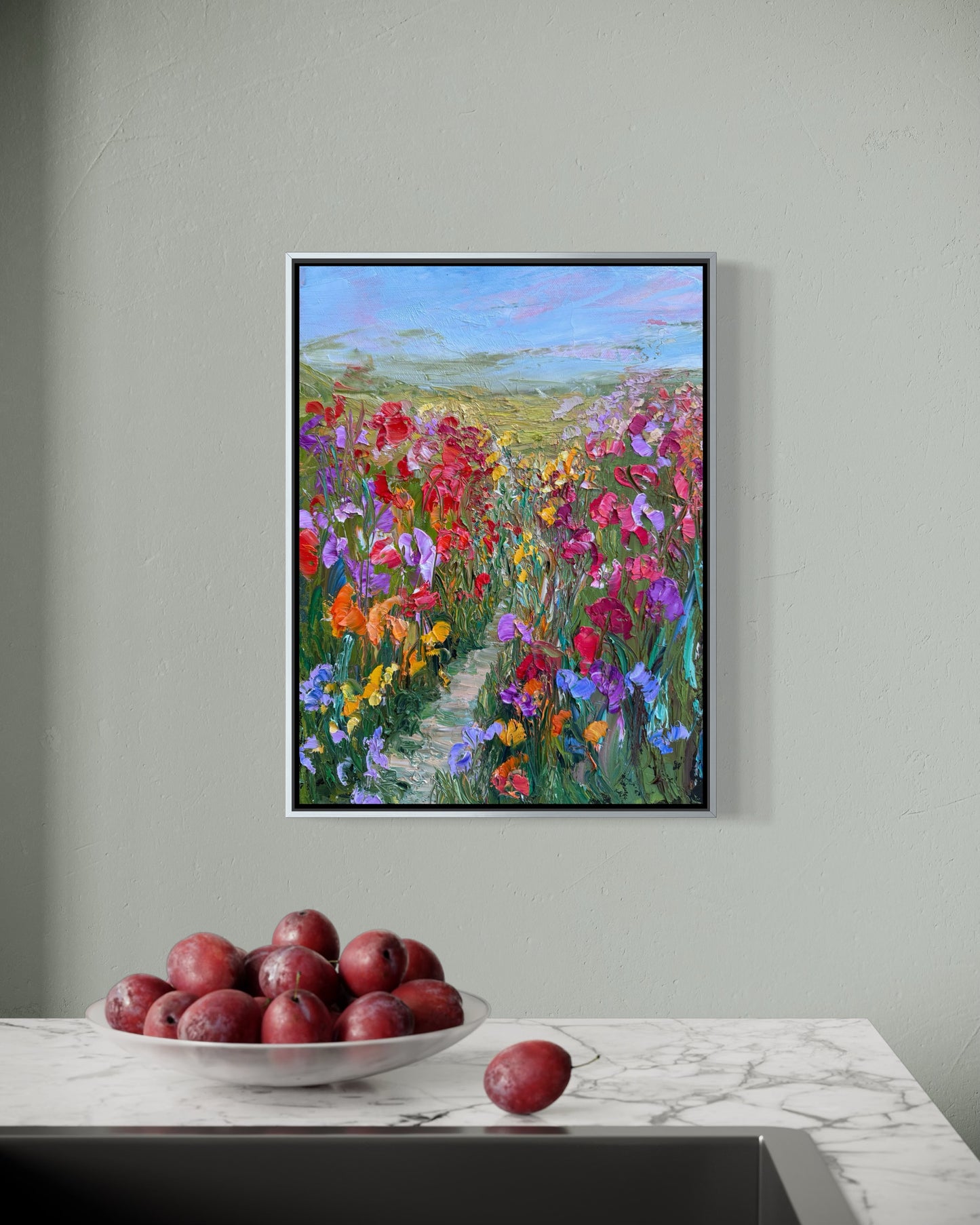 Colorful impressionist painting “Path Through Flower Field” by Maria-Victoria Checa styled in a contemporary kitchen interior.