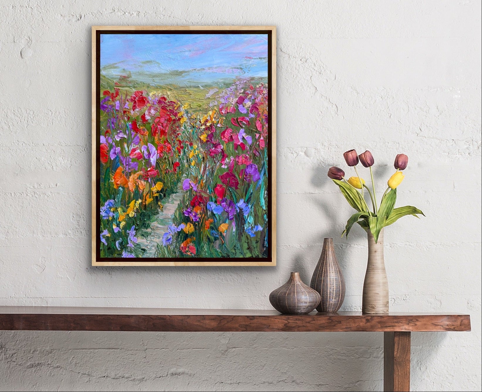 “Path Through Flower Field” by Maria-Victoria Checa styled in a bright, contemporary interior with natural textures.