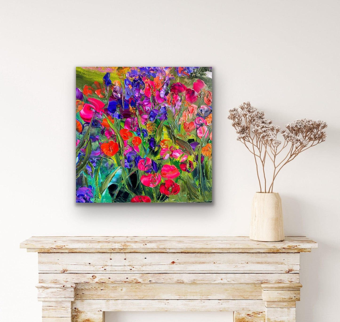Pink Flowers colorful floral art print displayed above a white fireplace by artist Maria-Victoria Checa.