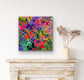 Pink Flowers colorful floral art print displayed above a white fireplace by artist Maria-Victoria Checa.