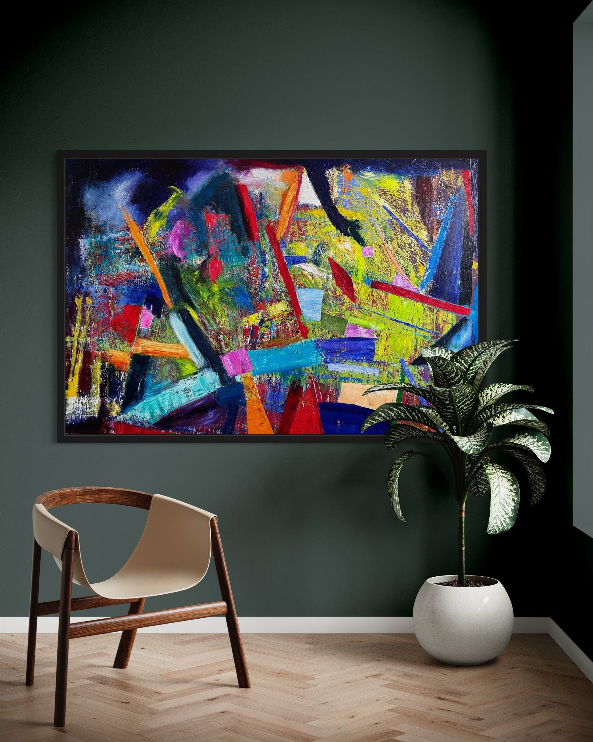 Play Time! colorful abstract oil painting displayed on a dark green wall with a modern chair and indoor plant.