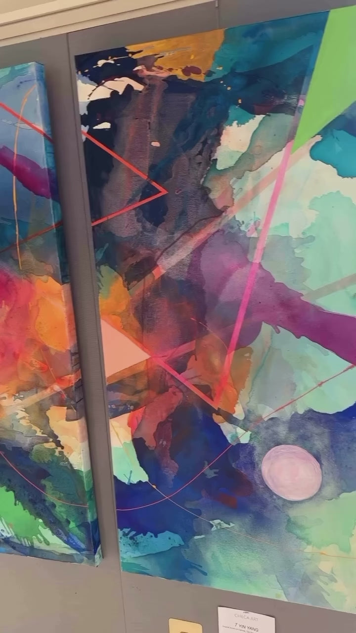 Video showing the Yin Yang abstract diptych by artist Maria-Victoria Checa displayed on a wall, slowly panning to highlight the bold colors and layered acrylic details.