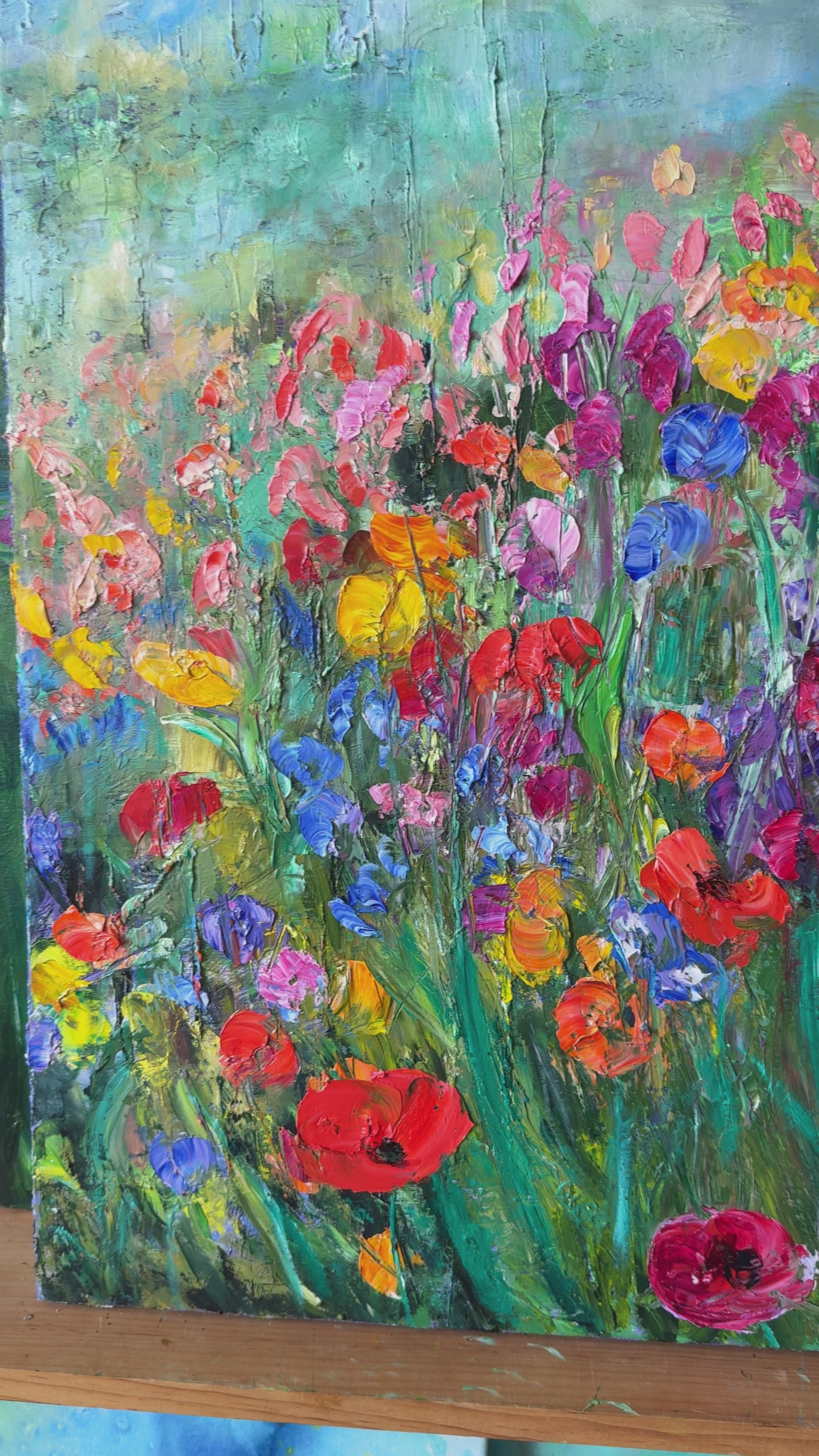 video-of-a-flower-field-painting-in-a-room-1