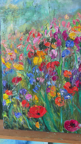 video-of-a-flower-field-painting-in-a-room-1