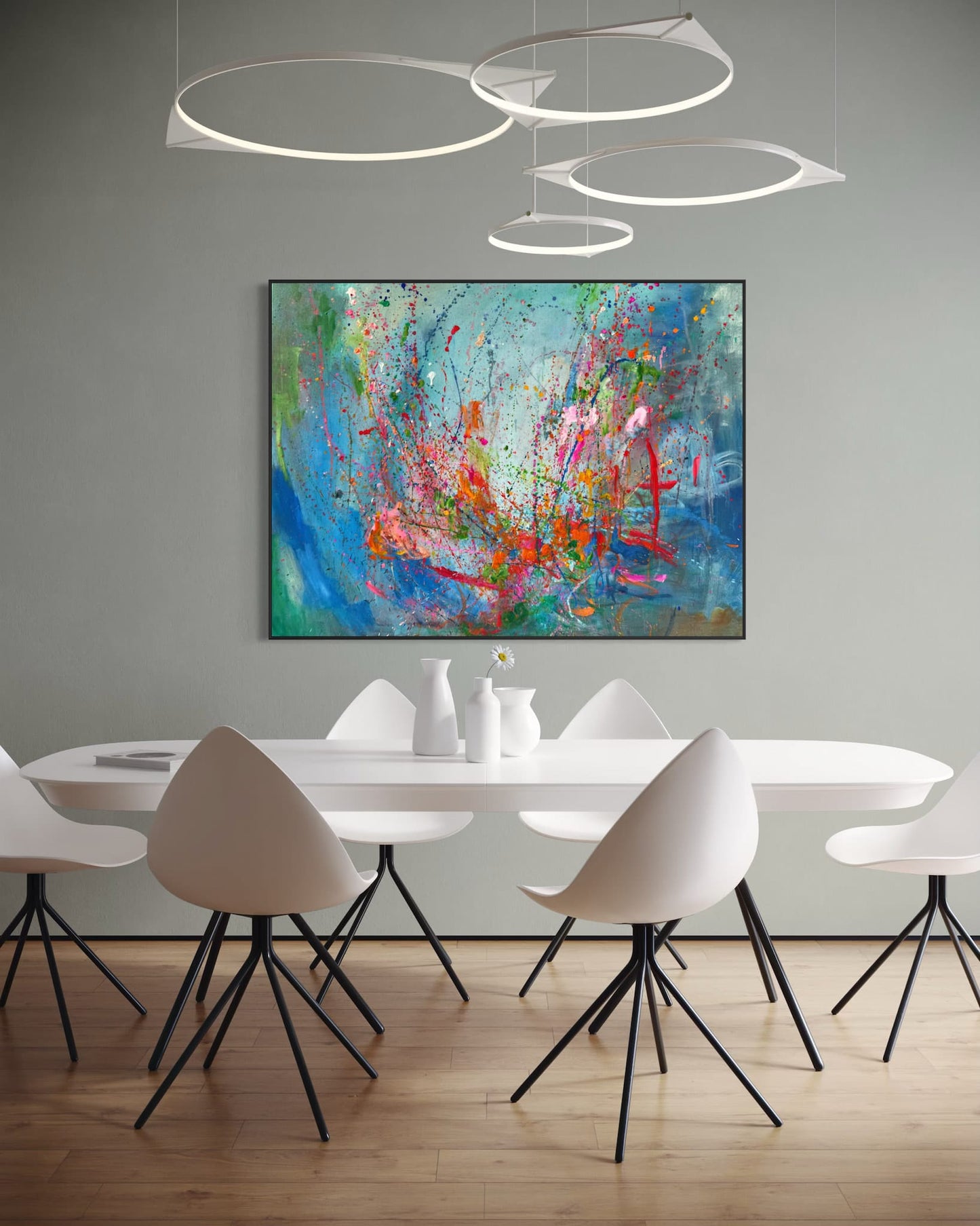 Roller Coaster abstract painting hanging in dining room above white table