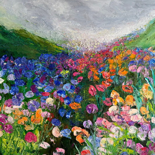 Detail of Somewhere in the Meadow, original impressionist oil painting by Maria-Victoria Checa, showing thick palette-knife texture in blue, magenta, orange, and pink wildflowers, 36x36 inches