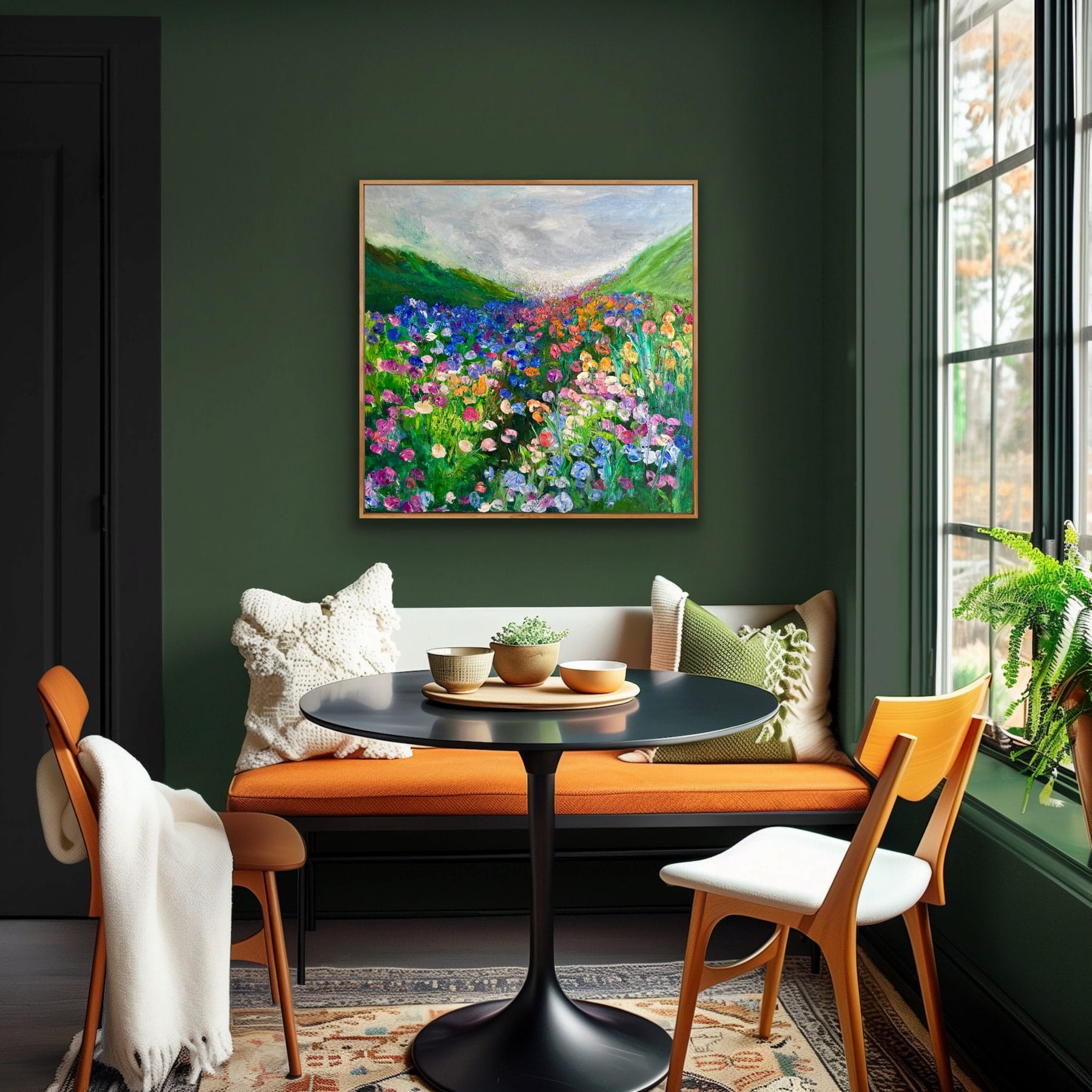 Somewhere in the Meadow original oil painting by Maria-Victoria Checa hanging in a dark green dining nook with orange banquette seating, 36x36 inches