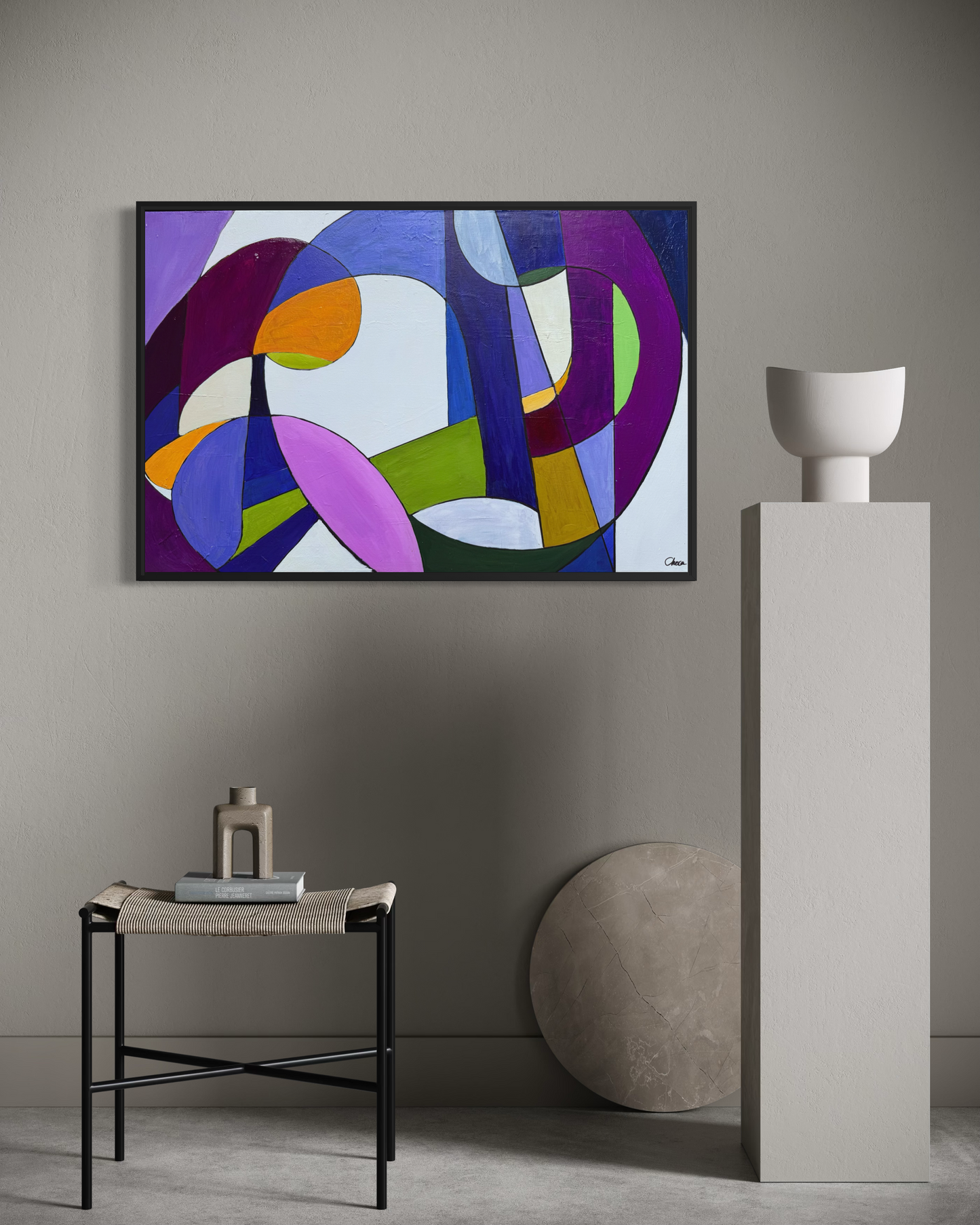 The Meal framed geometric abstract artwork displayed on a minimalist grey wall above a pedestal and modern décor.