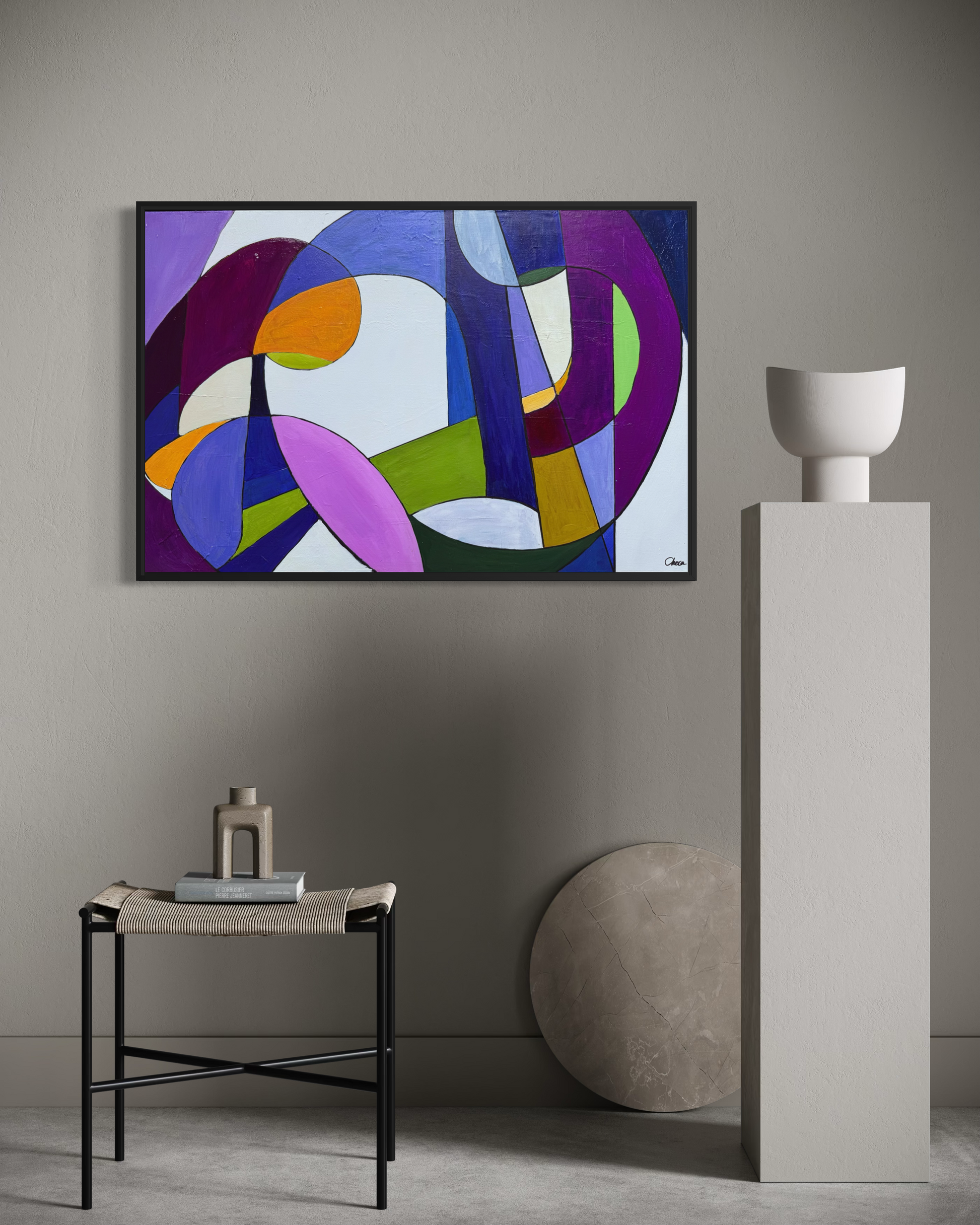 The Meal framed geometric abstract artwork displayed on a minimalist grey wall above a pedestal and modern décor.